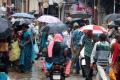 Rain dampens holiday mood - Sakshi Post