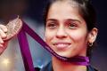 CM honours Saina Nehwal with Rs 50 lakh cheque - Sakshi Post