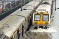 Heavy rains once again hit India’s economic capital city causing several trains and flights to run late. - Sakshi Post