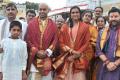 Coach Gopichand and PV Sindhu with her parents and temple officials in Tirumala, on Sunday. - Sakshi Post