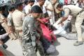 Police personnel dragging away protestors when they were enforcing a bandh call demanding special category status for Andhra Pradesh. - Sakshi Post