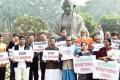 Biju Janata Dal (BJD) leaders including ministers staged a demonstration in front of Raj Bhavan on Wednesday. - Sakshi Post