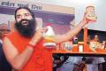 Baba Ramdev with Patanajali products - Sakshi Post