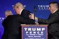 Republican presidential nominee Donald Trump was rushed off a stage at a rally in Nevada by security officials, on Saturday. - Sakshi Post