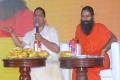 Patanjali CEO Acharya Balkrishna with Baba Ramdev - Sakshi Post