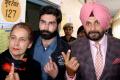 Navjot Singh Sidhu, his wife Navjot Kaur Sidhu and their son Karan Sidhu after casting their vote at a polling booth on Saturday. - Sakshi Post