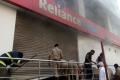 Firefighters on rescue operation at Reliance Digital, Kachigua - Sakshi Post