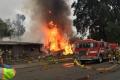 Raging fire at the site of the plane crash near Riverside Municipal Airport in California on Monday. - Sakshi Post