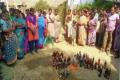 Women destroys liquor bottles in Muthyalamma Gudem - Sakshi Post