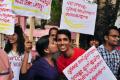 A woman kisses a boy during a protest in 2014 against moral policing - Sakshi Post