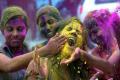 Girls smear the face of their friends with radiant colours - Sakshi Post