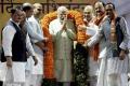 Prime Minister Narendra Modi and senior BJP leaders at the party headquarters on Ashoka Road, on Sunday. - Sakshi Post