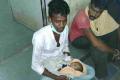 Family member of the deceased with the newborn baby - Sakshi Post