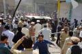 The scene outside a Shiite imambargah immediately after a car bomb explosion in the central bazar of Parachinar, Kurram Agency in Pakistan on Friday. - Sakshi Post