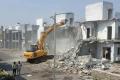 HMDA officials demolish villas at SRK Green Park at Bowrampet on Monday - Sakshi Post