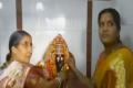 Jashodaben offering prayers in Nagadevatha temple - Sakshi Post