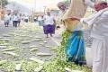 The agitated farmers dumped loads of vegetables in front of CRDA office as a protest - Sakshi Post