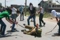 Hooligans attacking a police man in Kashmir valley - Sakshi Post