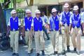 The police officials wearing cooling vests given to them to beat summer heat - Sakshi Post