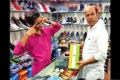 The shopkeeper Mahesh  was selling shoes in a box with national flag on it - Sakshi Post