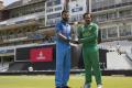 Indian captain Virat Kohli and Pakistan captain Sarfraz Ahmed pose with Champions Trophy ahead of final match on Sunday.&amp;amp;nbsp; - Sakshi Post