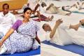 Governor of both the states E.S.L. Narasimhan and his wife Vimala Narasimhan along with the Governor’s staff officers participated in the yoga session held at Raj Bhavan in Hyderabad. - Sakshi Post