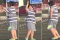 The boy dances to the 90s hit song “Macarena”at a street crossing in the Red Sea city of Jiddah - Sakshi Post