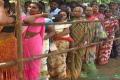 Women voters queue up at a polling booth in Nandyal bypoll on Wednesday - Sakshi Post