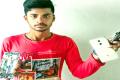 Dharmireddy Sai with the burnt Redmi Note 4 - Sakshi Post