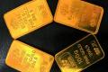 The seized  four gold bars of 24 karat worth Rs12 lakh - Sakshi Post