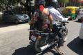 Karnataka government  bans pillion riding on two-wheelers with engine capacity of less than 100 CC - Sakshi Post