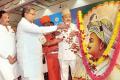 Karnataka CM Siddaramaiah paying floral tribute to a portrait of Tipu Sultan - Sakshi Post