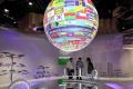 A globe with the national flags hangs in one of the pavilions at the UN Climate Conference in Bonn, Germany - Sakshi Post