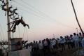 Body of Veera Reddy hanging from the pole - Sakshi Post