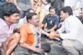 YS Jagan listens the woes of a disabled person at H Kairawadi in Gonegandla mandal - Sakshi Post