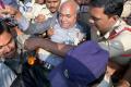 Kancha Ilaiah being detained by police on his way to participate a conference in Khammam on Sunday. - Sakshi Post