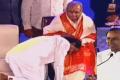 Telangana CM K. Chandrasekhar Rao takes blessings of his guru Brahmasri Mrutyunjaya Sharma at the inaugural ceremony of World Telugu Conference in Hyderabad on Friday - Sakshi Post