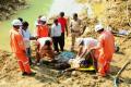 Rescue workers removing the body of Dhanam Gopi - Sakshi Post