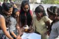 Students brush up their knowledge before entering the exam hall (representational image) - Sakshi Post