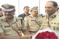 Malakondaiah (right) takes charge from the outgoing DGP N. Sambasiva Rao in Vijayawada on Sunday - Sakshi Post