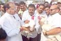 TDP MP Thota Narasimham and MLA NVSN Varma pitching their respective roosters into the arena - Sakshi Post