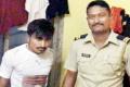 The accused Haridas Nirude with Mumbai policeman - Sakshi Post