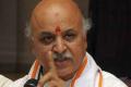 Togadia Escapes Unhurt As Truck Hits His Car - Sakshi Post