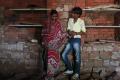 Child bride Krishna, 13, stands with her husband Kishan Gopal, 15, inside a newly constructed room at her house in a village near Baran, located in the northwestern state of Rajasthan, July 17, 2012. - Sakshi Post