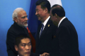 Prime Minister Narendra Modi shakes hands with Pakistan President Mamnoon Hussain, Chinese President Xi Jinping at the SCO Summit in Qingdao - Sakshi Post