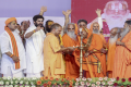 UP CM Yogi Adityanath lights the lamp during a function to celebrate the 80th birthday of Ram Janam Bhoomi Trust President Nritya Gopal Das, in Ayodhya - Sakshi Post