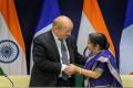 French foreign minister Yves Le Drian with Indian foreign minister Sushma Swaraj in New Delhi on Saturday. Photo: PTI - Sakshi Post