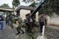 Kenyan Security forces aim their weapons up at buildings&amp;amp;nbsp; - Sakshi Post