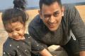 Dhoni playing with Ziva (File Image) - Sakshi Post