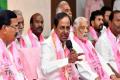 A file photo of Telangana CM K Chandrasekhar Rao with party leaders - Sakshi Post